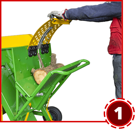 Place the log of wood in the saw compartment